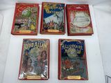 six children ' s books are lined up on a white surface