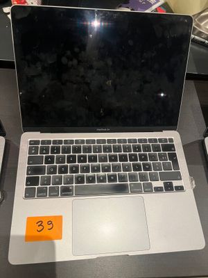 a laptop that is sitting on a desk next to a keyboard