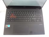 a laptop with a keyboard on it sitting on a table