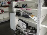a shelf with many items on it in a store