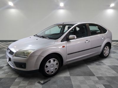 a picture of a silver car parked in a garage