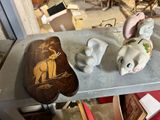 three elephant figurines sitting on a shelf in a room