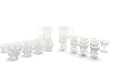 a lot of glasses that are sitting on a table