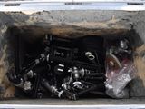 a box full of assorted pipes and fittings in it
