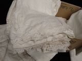 a box that has some white clothing inside of it