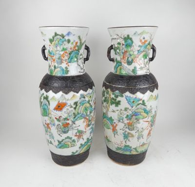 pair of chinese vases with floral designs on them on a white background