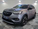 the grey opel is parked on a checkered tile floor