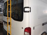 a white van with a ladder on the back of it
