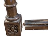 a close up of a metal pole with a flower design on it
