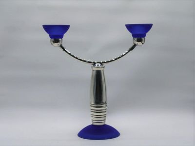 a picture of a blue glass candle holder on a white background