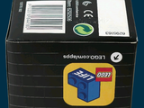 a box of legos sitting on a blue surface