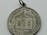 a close up of a coin on a white surface