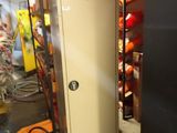 a fire extinguisor in the corner of a room