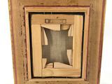a picture of a wooden frame with a picture in it