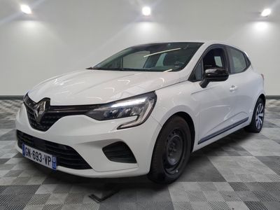the white car is parked on a checkered floor in the garage