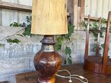a lamp that is sitting on top of a wooden table