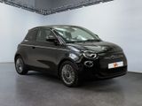 an image of a black smart car in a showroom