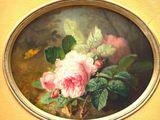 a picture of a painting of pink flowers in a gold frame