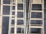 two ladders that are standing next to each other