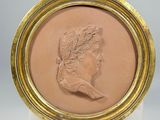 an image of a picture of a woman ' s profile in a gold frame