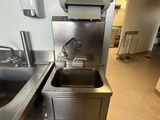 a stainless steel sink and a stainless steel sink in a kitchen