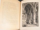 an open book with a picture of a building inside of it