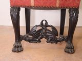a red upholstered bench with a red upholstered seat