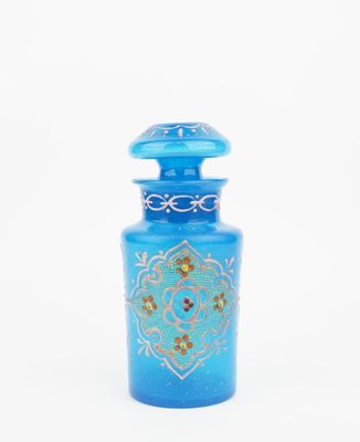 blue glass bottle with a gold and blue design on it