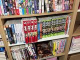 a book shelf full of dvds and movies on it