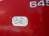 a sticker on the side of a red bus