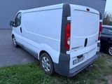 a white van that is parked in a parking lot
