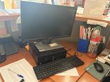 a desktop computer sitting on a desk with a keyboard and mouse