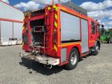 a fire truck that is parked in a parking lot