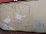 a picture of a painting of birds on the wall