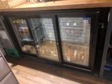 two glass doors on the back of a refrigerator