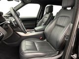 the interior of a car with black leather seats and a center console