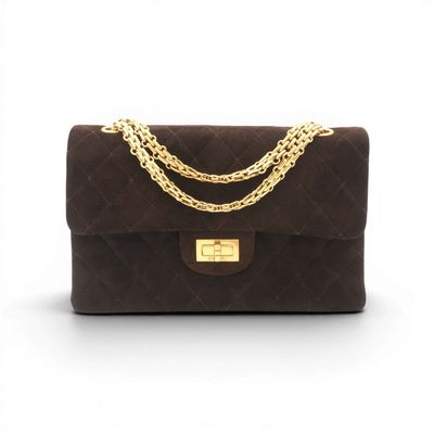 a brown quilted bag with a gold chain on the handle