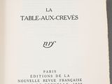 an open book with a picture of a table - aux - creves written in french