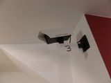 a picture of a camera mounted on the wall of a room
