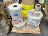 many rolls of paper sitting on top of a pallet