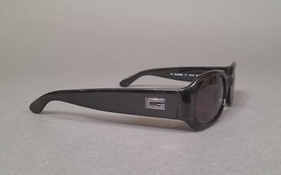 sunglasses on a table with a white background and a gray background