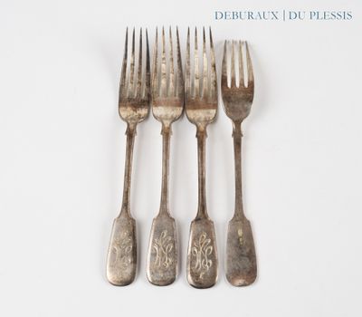 three forks and a knife are sitting on a white surface