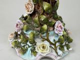 a figurine of a tree with flowers on it