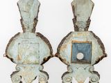 pair of blue and white sculptures of a man and a woman