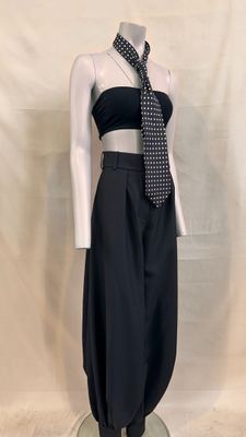 a mannequin wearing a black top and black pants