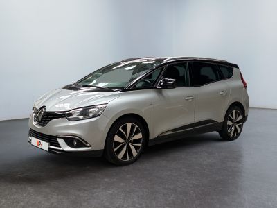a silver car is parked in a white room with a black floor