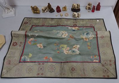 a table with a table cloth on it that has a lot of items on it