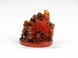 une image représentant une figurine d'un chariot tiré par des animaux
