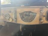 a dashboard of a car with a clock on it