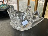 glass bowl on a table in front of a glass display case